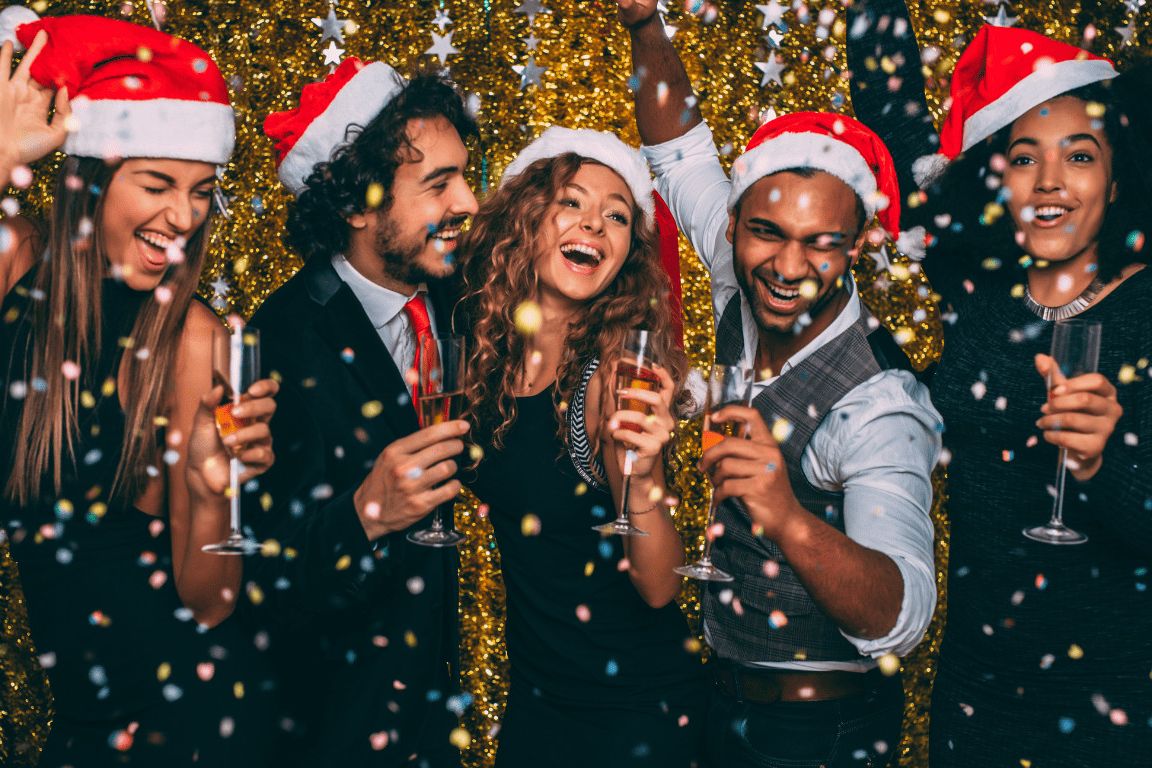 A group of 5 colleagues celebrating at a work Christmas party.