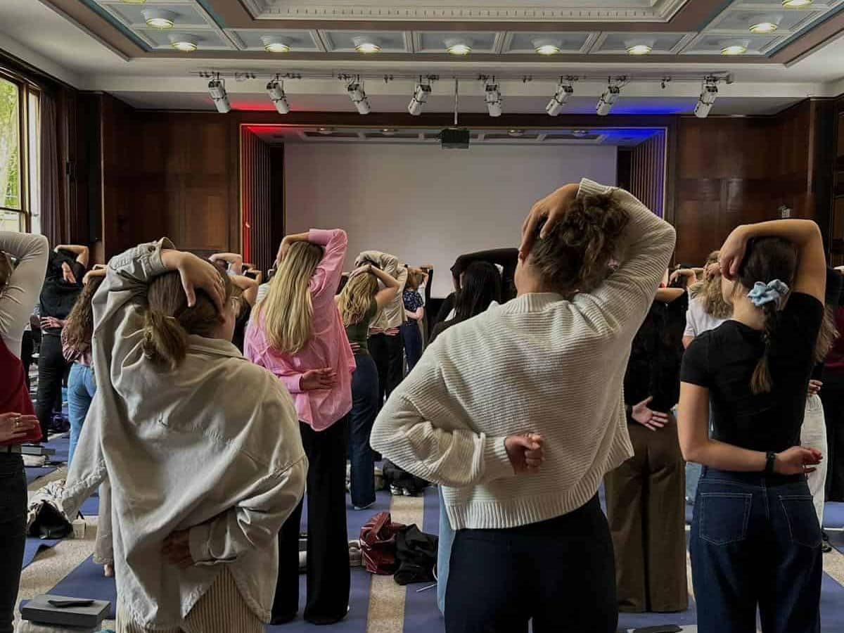 A group of people taking part in yoga